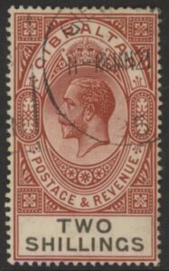 1929 Gibraltar SG.103  2/- red-brown & black. watermark multi script CA. Vfu.